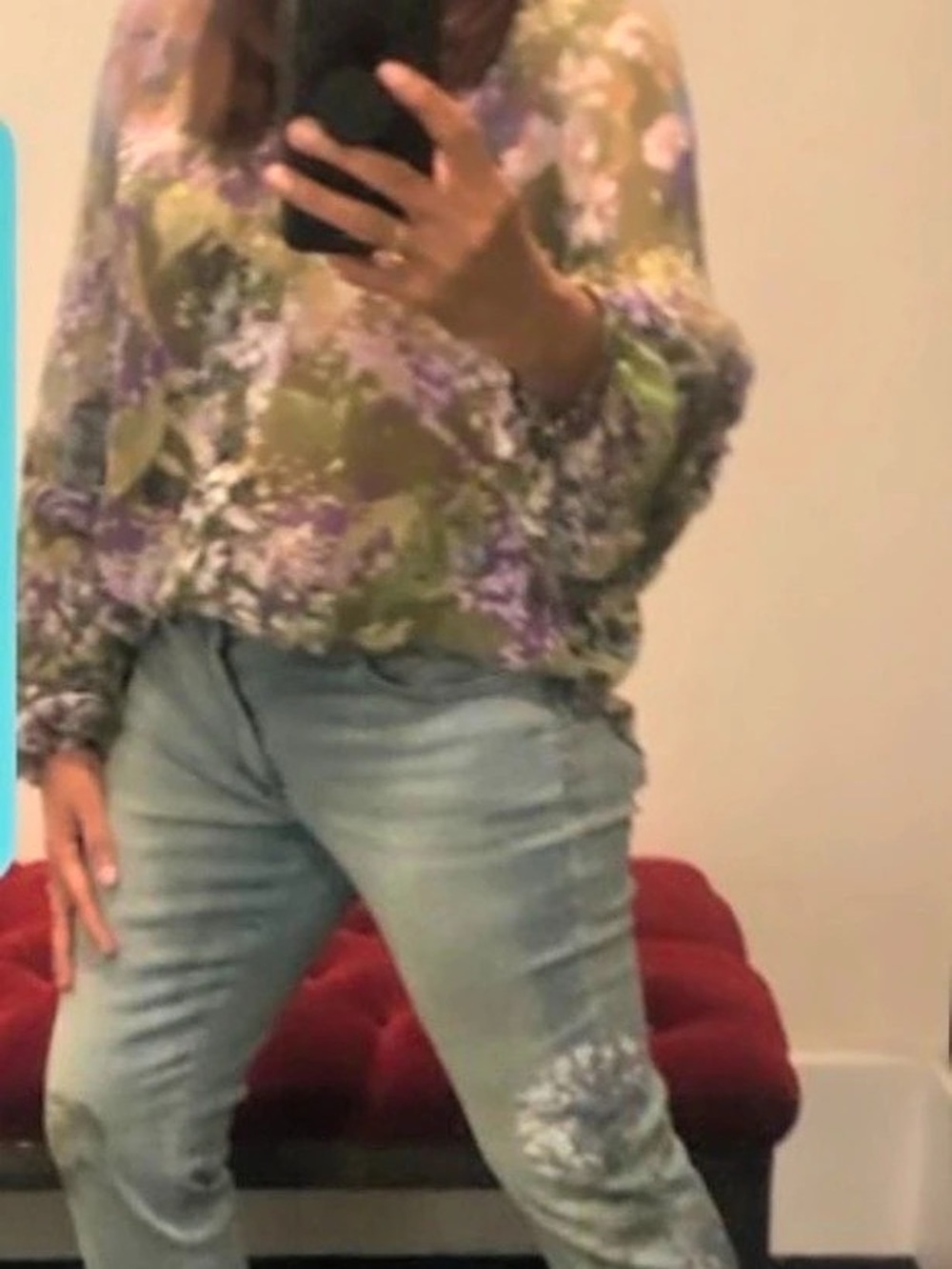 White House Black Market straight leg jeans with floral graphic.